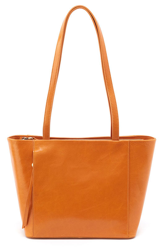 The Haven in warm amber is your new go-to tote with a top zip closure and plenty of room for your belongings.
