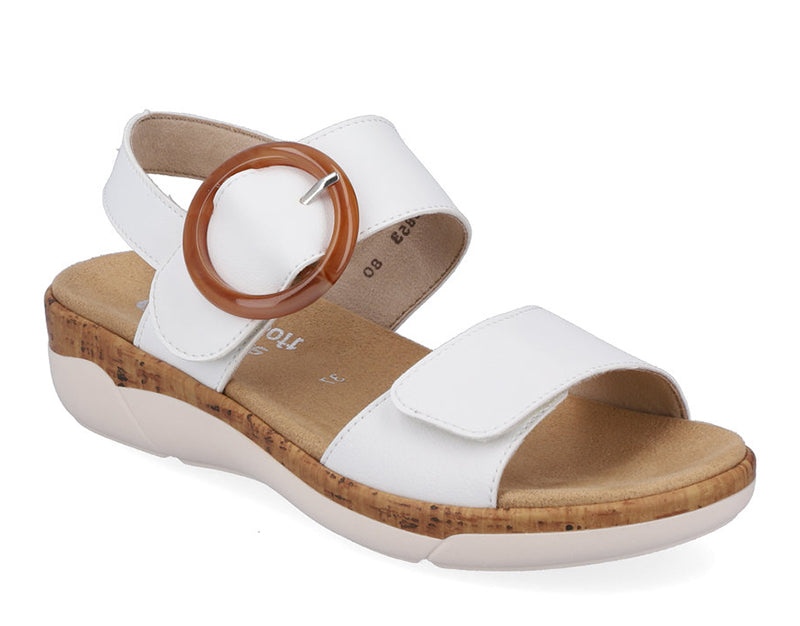 The Jocelyn by Rieker is a fun strappy sandal and part of the Remonte collection. A low, lightweight sandal with a velvety molded footbed features dual adjustable straps for easy comfort and style.   White leather with a decorative brown buckle.