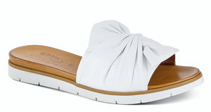 LAVONA Flexible outsole, white slip on style with a beautiful leather twist bow