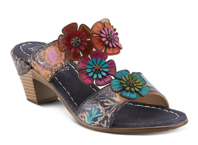 Asymmetrical flower design adds a unique and eye-catching touch. - Leather-wrapped low stacked heel offers stability and durability for all day wear. - Hook and loop closure allows for easy and adjustable wear.