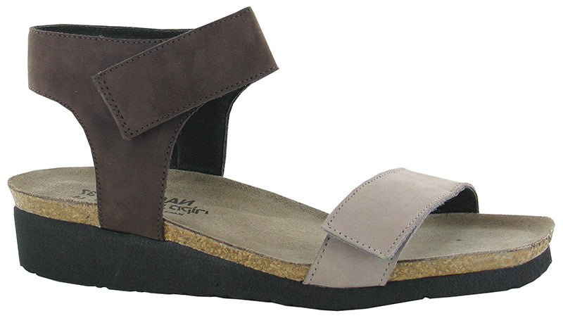 With a padded upper strap, Alba is a solace for your foot.  Partnered with contrasting colors, Alba pairs perfectly with many fashions.    Naot's anatomic cork and latex footbed is wrapped in pampering suede and molds to the shape of the foot with wear.  Heel height is approximately 1 inch.