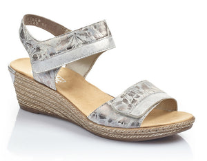The Fanni 70 by Rieker is molded in a pattern of braided jute.  A low, lightweight wedge sandal with a velvety molded footbed features dual adjustable straps for easy comfort and style.  Heel height is approximately 2 inches.