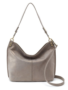 A forever favorite from the HOBO design archives, our Gardner shoulder bag is perfectly slouchy with a tassel designed to move with you. Gardner will be the bag you always reach for, the one you throw over your shoulder and head out the door. Crafted in our signature Velvet Pebbled Hide, our softest and most casual leather that only gets more beautiful over time.