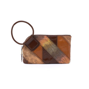 A HOBO icon and best seller, Sable is the clutch you'll want in at least one color. Designed with our signature circular handle, Sable will securely stow away your essentials as you grab it and go. Crafted in a limited edition leather Patchwork featuring seasonal shades and added textures.