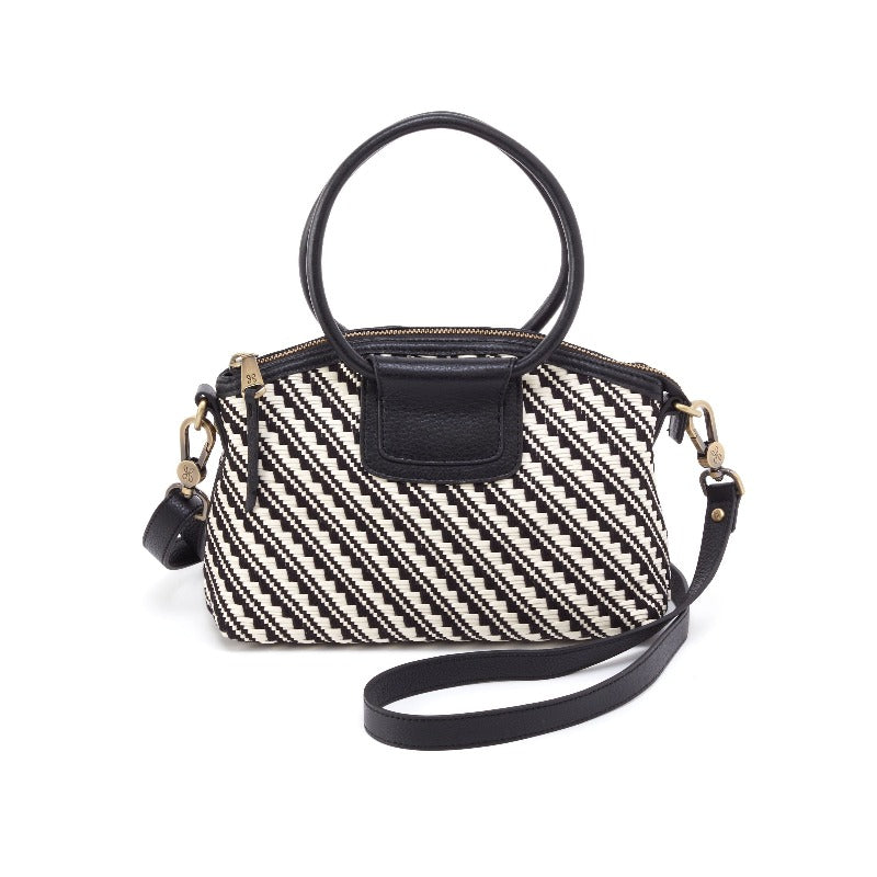 The Sheila Top Zip Crossbody is made in artesian woven leather.  This textured leather only gets better with time.  Features a compact size, interior organization and a removable strap for two looks in one.