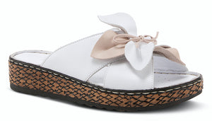 Make a dynamic statement with this whimsical, high quality and butter soft leather slide sandal featuring a flower applique and padded foot bed on a lightweight comfort sole with a flexible forefoot. Upper: Leather Lining: Leather Insole: Leather Outsole: Polyurethane Closure: Slip-on Heel Height: 1 1/2" Platform Height: 1" Features: - Comfort, Flexible Sole, Padded Insole, Premium Made in Turkey