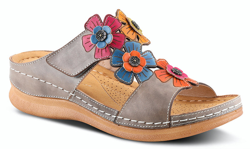 The Izna is a cute hand painted leather slide sandal featuring colorful cut out flower design with metal embellishment accents, adjustable top strap with inside elastic gore for extra comfort all on a super padded foot-bed and flexible sole. Heel Height: 1.75 inches.   Disclaimer: L’Artiste products are made with natural tanned leather using traditional hand painting techniques. This unique finishing process is used to create a natural effect with color variations to deliver authentic look and beauty.