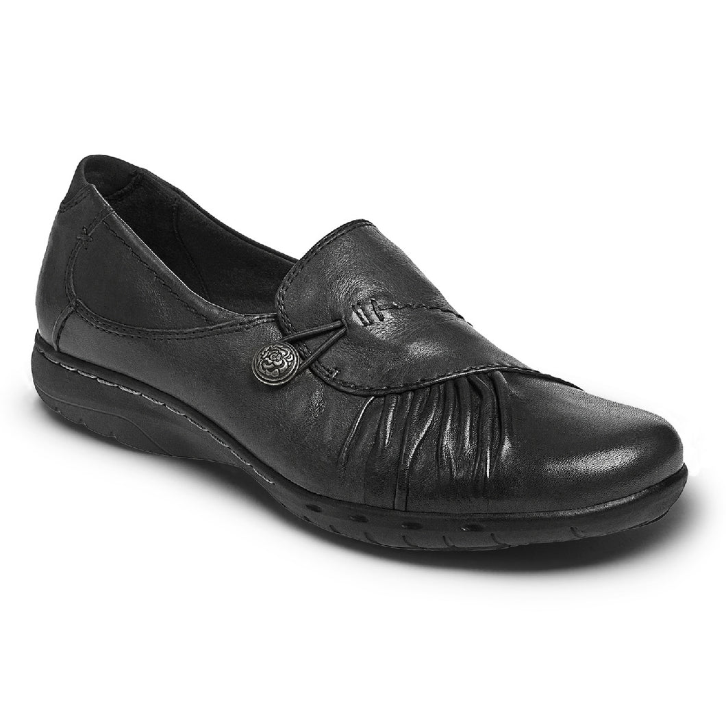 Sometimes you just need a good solid shoe for all-­day comfort. But what about all-around style? This Cobb Hill modern slip on has it all with asymmetrical ruching over the top and an antique metal button with bungee clasp for an ever so fashionable fit. The heel height is 1.25 inches