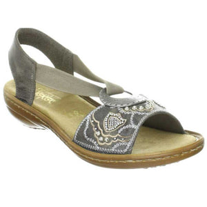The Rieker Regina B9 sandal is fun.  This lightweight, extra flexible sandal encourages natural motion and makes it easy to be on your feet all day long.  Features a leather upper with a decorative design.  Elastic straps allow for a personalized fit.  The heel height is approximately 1 inch.