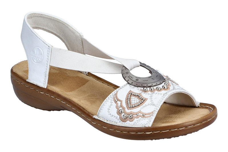 The Rieker Regina B9 white sandal is fun.  This lightweight, extra flexible sandal encourages natural motion and makes it easy to be on your feet all day long.  Features a leather upper with a decorative design.  Elastic straps allow for a personalized fit.  The heel height is approximately 1 inch.