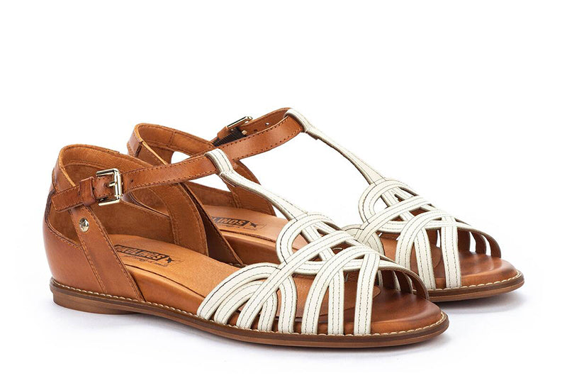 Nothing complements your style like the Pikolinos® Talavera T-strap sandal. The sandal has an intricate strappy leather upper that resembles a woven design for an elevated look. Peep-toe silhouette. Adjustable buckle closure at the instep.