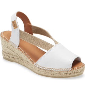 This open-toe, espadrille-inspired sandal with a colorfully printed upper, jute-wrapped wedge sole and handcrafted detail is the epitome of sunny style. 2 1/2" heel Leather upper/synthetic and textile lining/synthetic sole Made in Spain