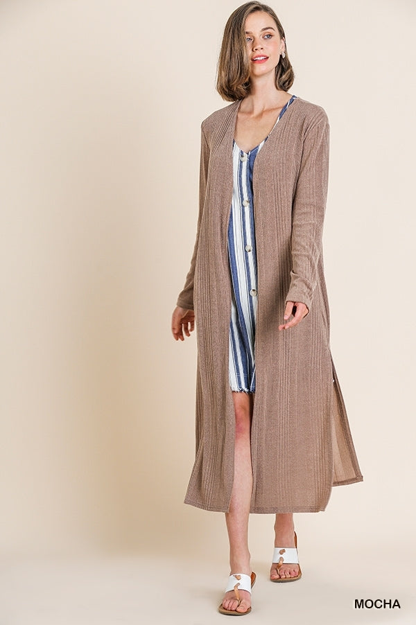 Long sleeve open front cardigan with side slits. 95% Polyester 5% spandex.