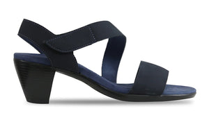 Munro Lucia in navy features an asymmetrical strap with a hook and loop closure. Padded micro suede sock covers a molded insole with a shock absorbing and flexible rubber outsole. Heel height is approximately 2 inches.