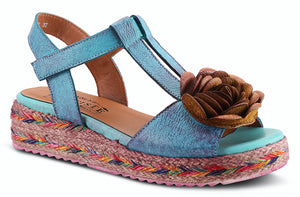 Tempest is a  French inspired brushed leather quarter strap sandal featuring a multi-color jute wrapped wedge with an adjustable hook and loop closure ankle strap, a well padded insole and a decorative 3 dimentional flower. Heel Height is approximately 1.75 inches. Disclaimer: L’Artiste products are made with natural tanned leather using traditional hand painting techniques. This unique finishing process is used to create a natural effect with color variations to deliver authentic look and beauty.